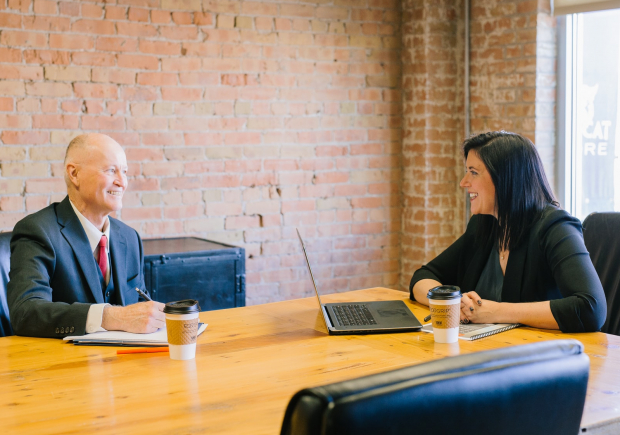 two meeting over conference table