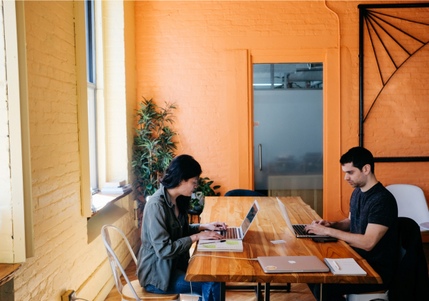 two working at computers