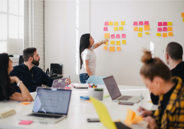 A photo of a diverse strategy group meeting