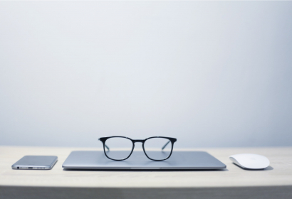 photo of a laptop, mouse, and mobile phone
