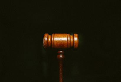 Photo of a gavel on a black background