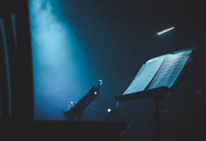 photo-of-illuminated-sheet-music