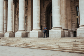 photo-of-man-in-suit-on-stairs