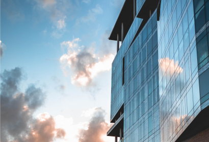 photo-of-clouds-reflected-on-building-securities-corporate
