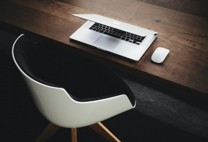 An-empty-seat-near-desktop-reflecting-staff-changes