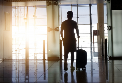 photo-of-man-walking-through-an-airport-travel-flights-vacation-airplane