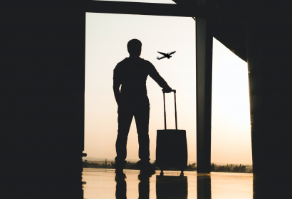 photo of man at airport backlit and in shadow