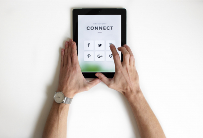 photo of tablet and social media platforms