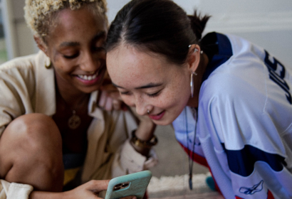teens smiling on a cellphone