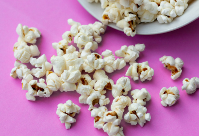 purple background popcorn photo
